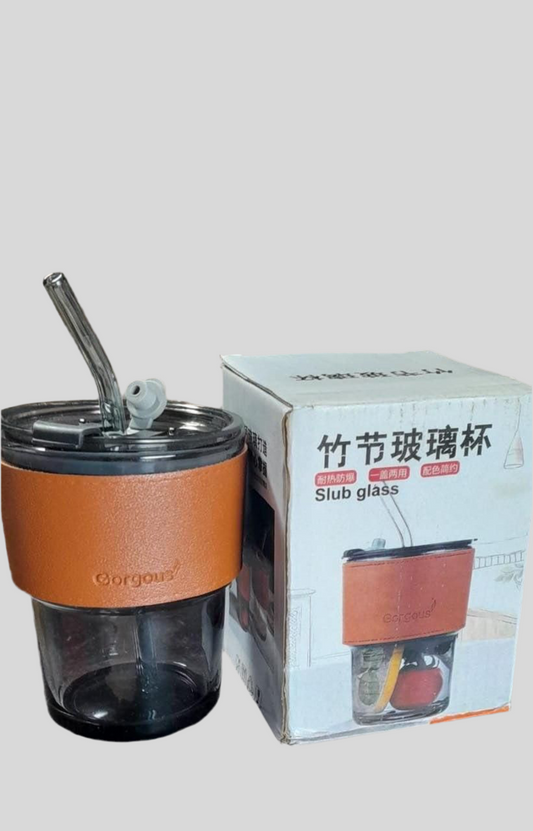 Over glass water bottle with straw